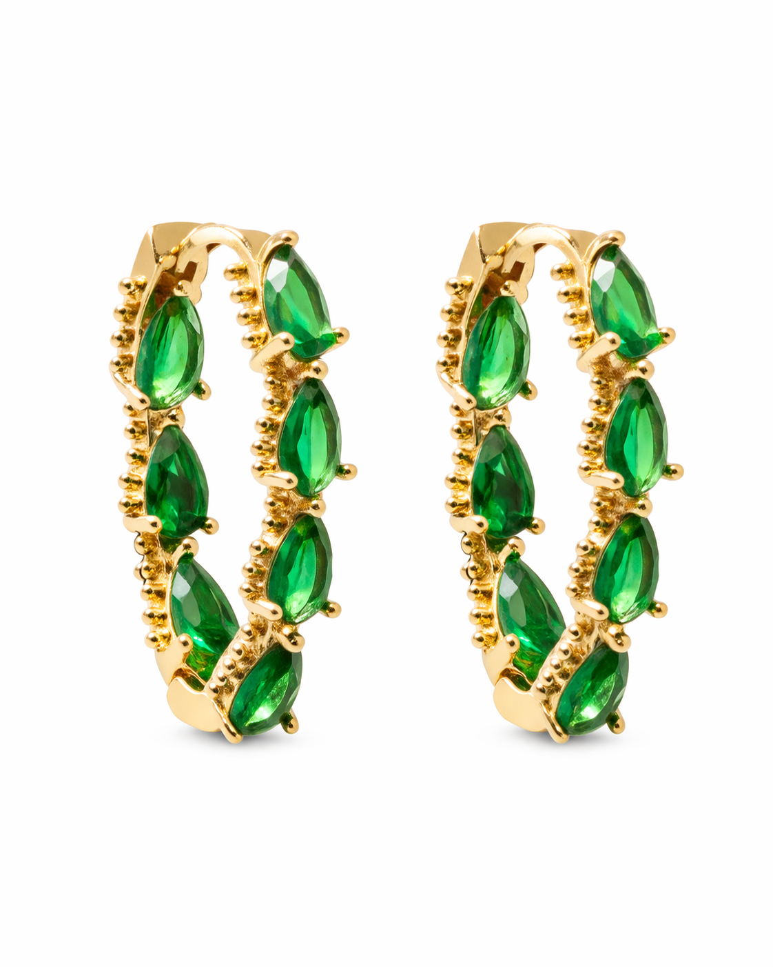 Gold hoop earrings with green gemstones on a white background